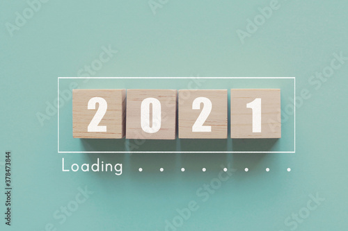 Wooden blocks in loading bar for 2021 Goal planning business concept photo