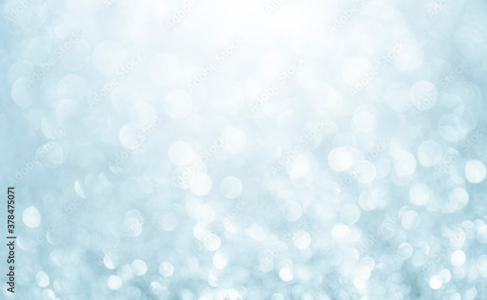 White glitter vintage lights background. Bokeh silver and white. defocused and copy space.	