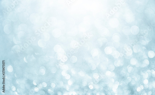 White glitter vintage lights background. Bokeh silver and white. defocused and copy space. 