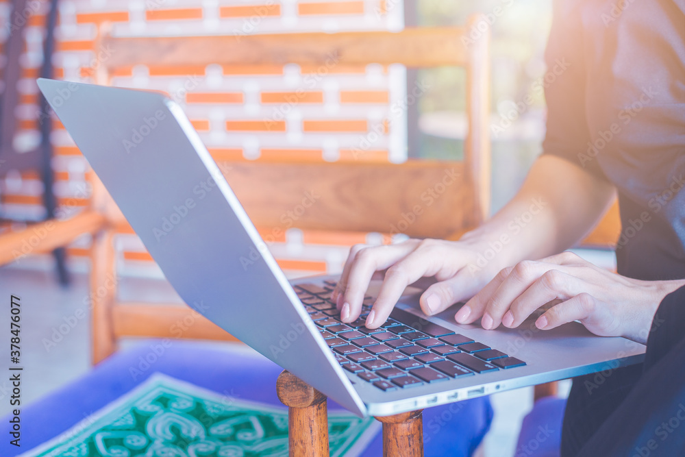 Women work with laptops in the office.