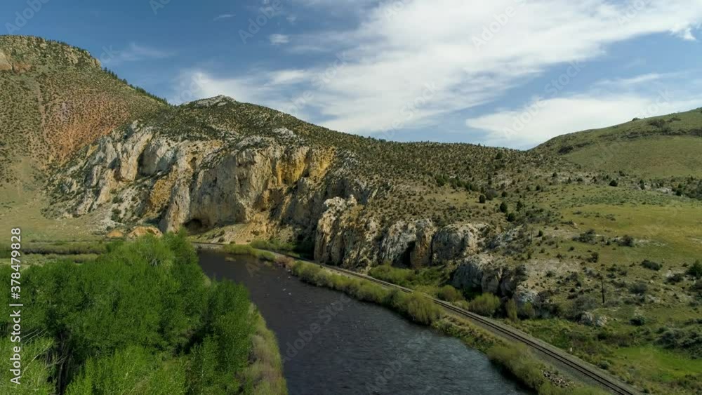 Aerial View of the river Maiden Rock Montana Landscape Mountain and roads with rocks at high noon from drone Aerial View of the river Maiden Rock Montana Landscape Mountain and roads with rocks at high noon from drone