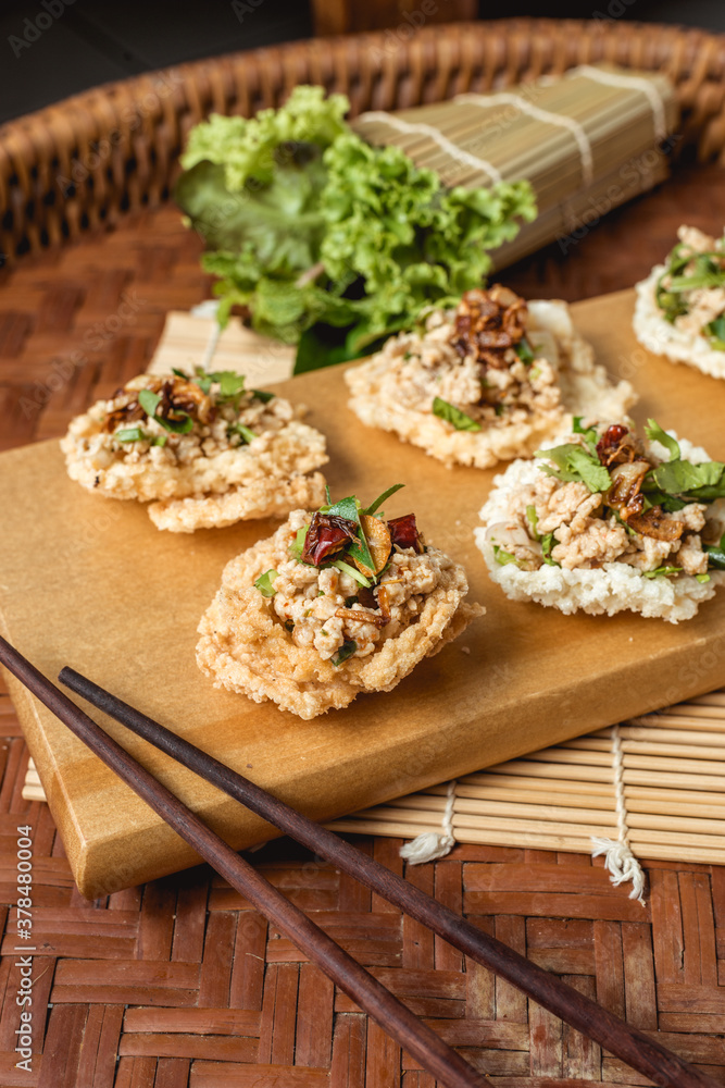 Creative food. Puffed rice and spicy minced pork salad on topping. Creative food. Puffed rice and spicy minced pork salad on topping.