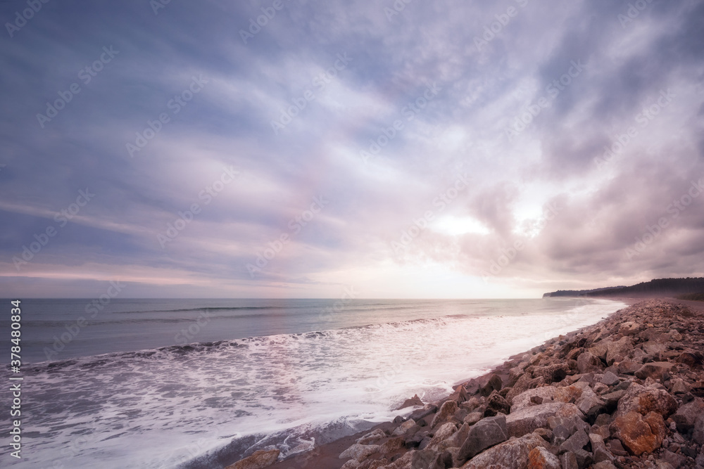 Sunset at Bruce Bay, a normally windswept beach on the West Coast of New Zealand near Haast Highway at the Tasman Sea.