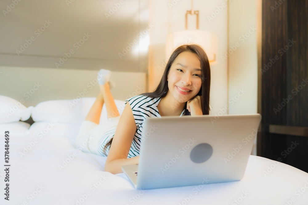 Portrait beautiful young asian woman use computer laptop on bed Portrait beautiful young asian woman use computer laptop on bed