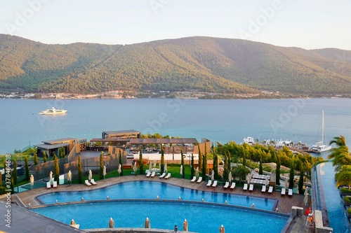 Bodrum, Turkey - August 2020: Hotel beach Lujo. Vacation in Paradise. Beautiful tropical beach banner. White sand travel tourism wide panorama background concept. Amazing beach landscape, yachts