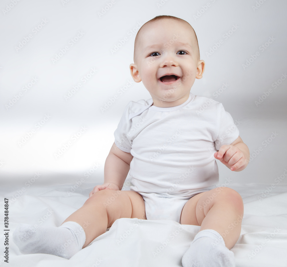 Image of a ten-month-old smiling baby on a white background Image of a ten-month-old smiling baby on a white background