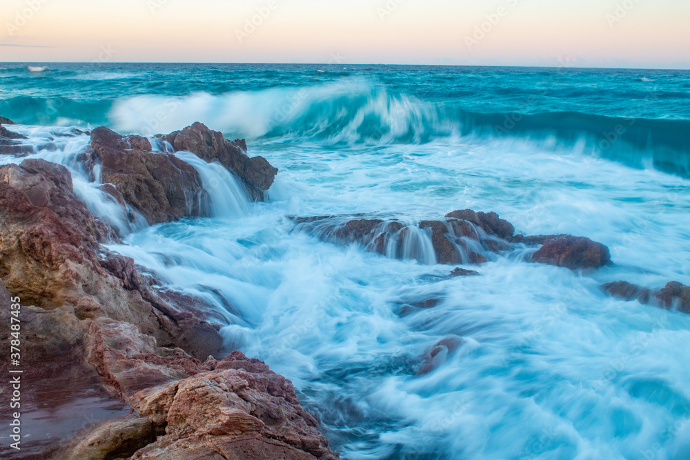 Waves hitting rock pools