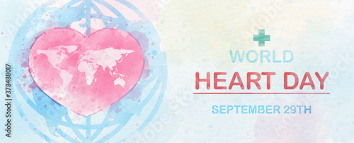 Pink heart with world map and the day and name of event on global icon on colorful watercolor and white paper pattern background. Poster campaign of World Heart Day in banner and watercolors style.