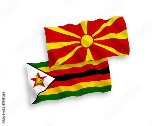 Flags of Zimbabwe and North Macedonia on a white background