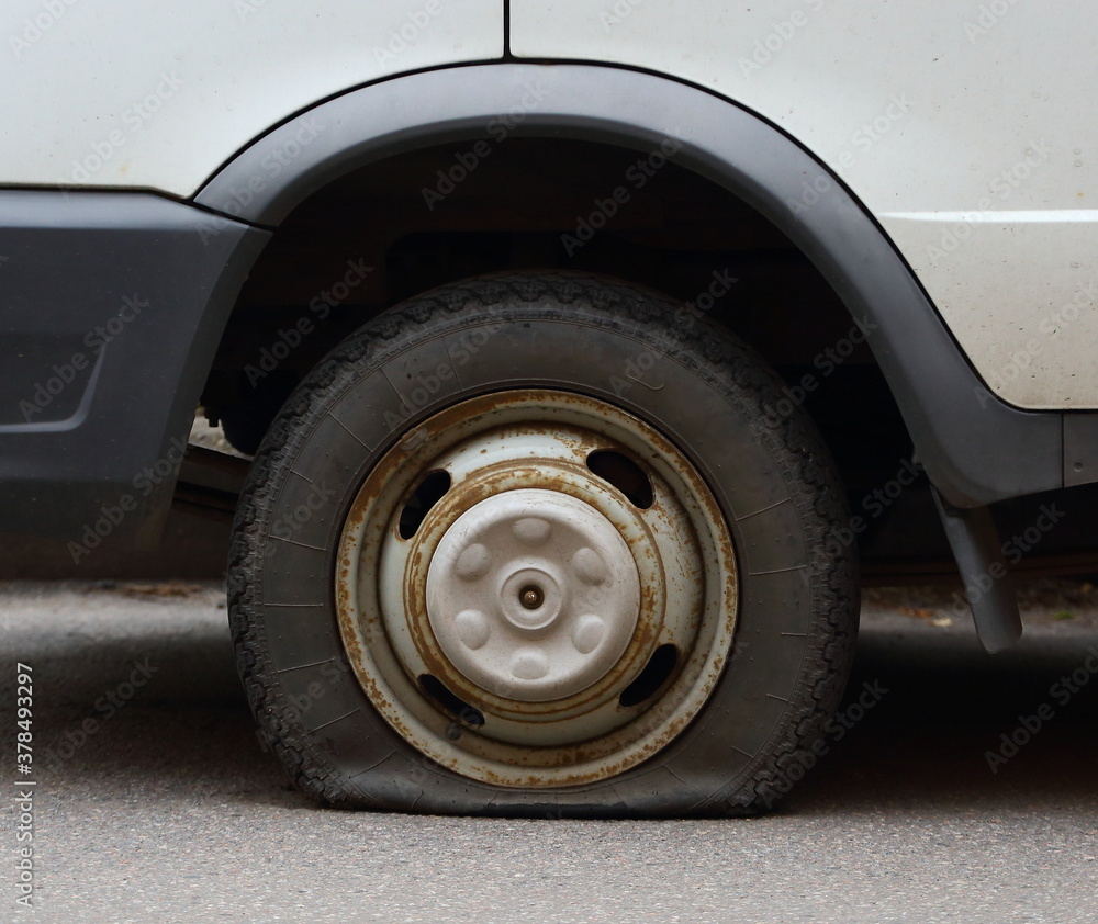Punctured wheel of a small car