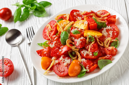 tomato salad with fried onion, quinoa and basil