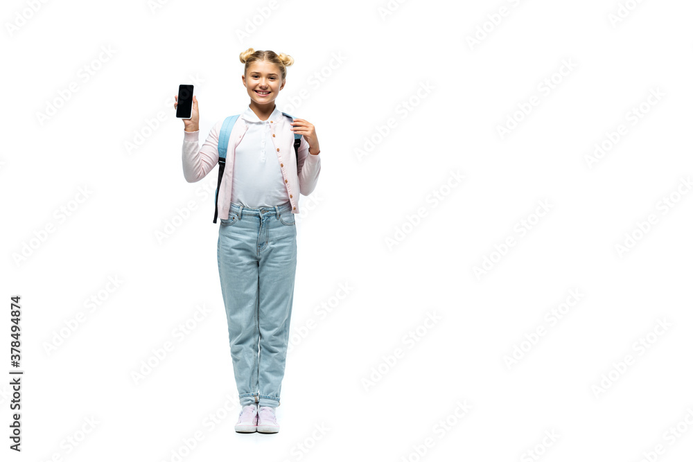 Schoolkid pointing with finger at smartphone on white background Schoolkid pointing with finger at smartphone on white background