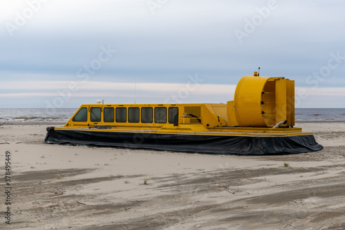Bilde på lerret Yellow hovercraft on the sand beach close up