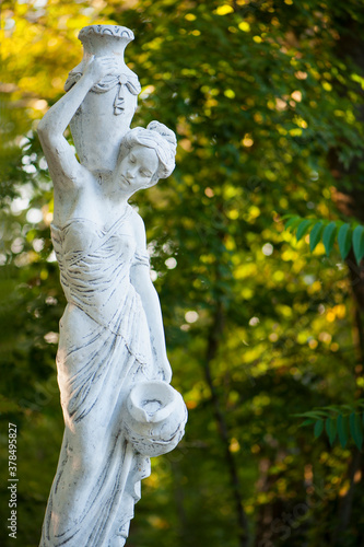 Canvas Print sculpture of a girl in autumn park