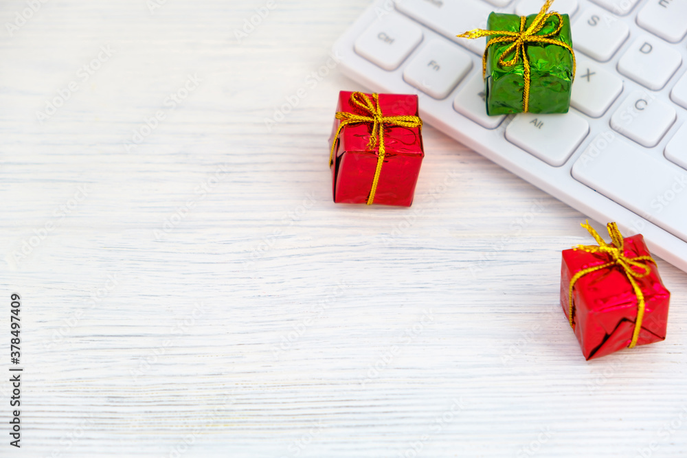 present on computer keyboard - christmas online shopping concept present on computer keyboard - christmas online shopping concept