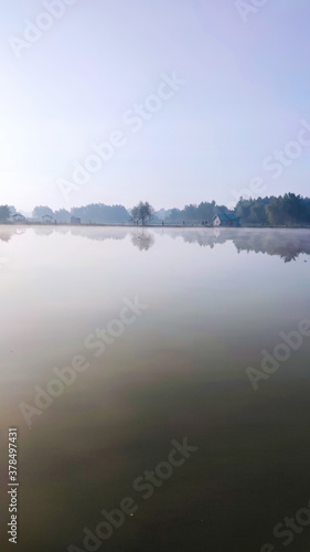 Fishing lake in the foggy morning © thaarey1986