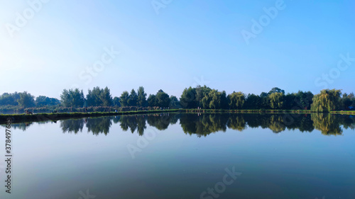 Fishing lake in the foggy morning