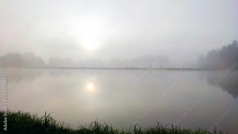Fototapeta premium Fishing lake in the foggy morning