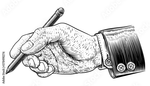 A hand in business suit holding a pencil in a vintage retro engraved or etched woodcut print style