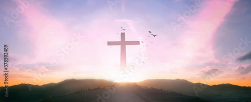 Fotografie, Obraz Religious concept: Silhouette cross and birds flying on  sunrise background