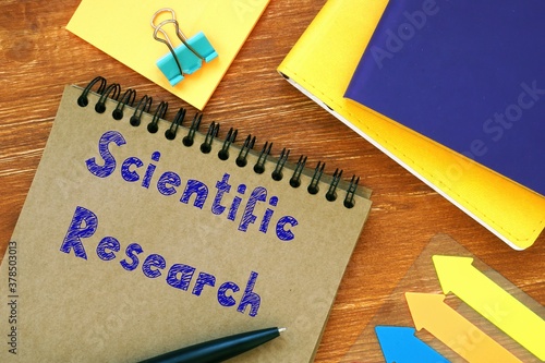Business concept about Scientific Research with phrase on the sheet.