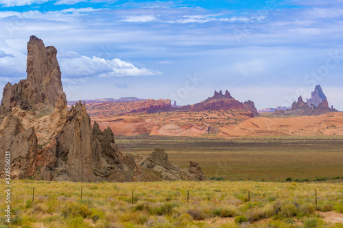 Utah Monument Valley rock landforms jut in sharp relief out of the surrounding land