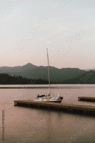 Sailboat moored at dock on tranquil Whiskeytown Lake, Redding, California, USA
 photo