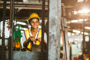 American black women labor worker at forklift driver happy working in industry factory logistic shipping warehouse.