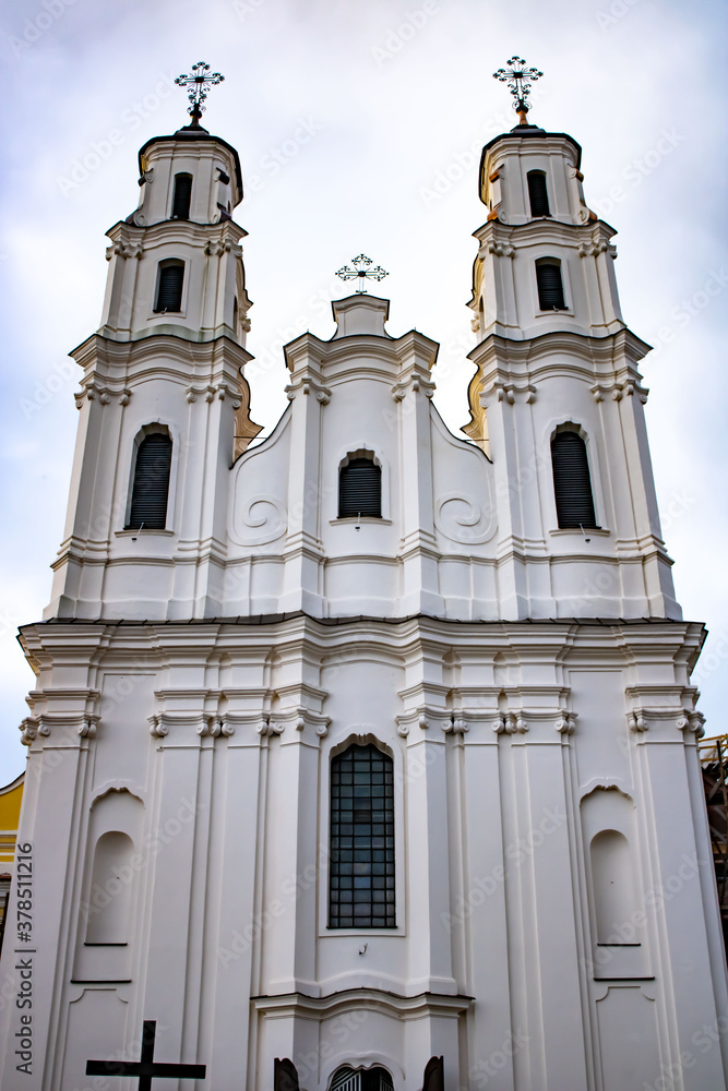 Fototapeta premium White Catholic Church in Belarus in the city of Glubokoe. Catholic church of the Holy Trinity.