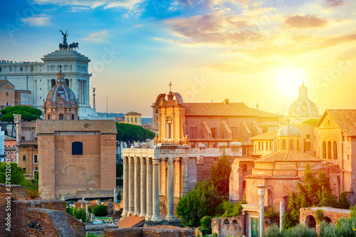 Aerial panoramic cityscape view of the Roman Forum and Roman Altar of the Fatherland in Rome, Italy. World famous landmarks in Italy during summer sunset