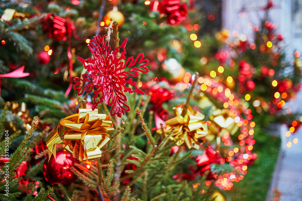 Christmas tree decorated with red baubles and snowflakes Christmas tree decorated with red baubles and snowflakes