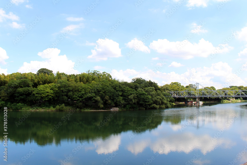 Bridge connecting Okayama Korakuen Garden and its reflection