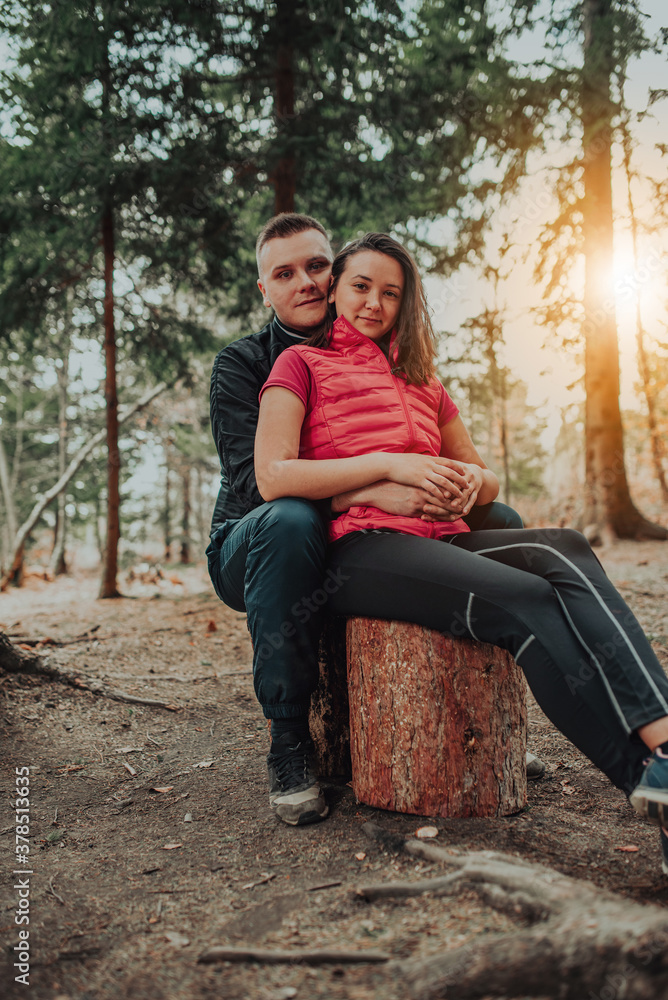 the young couple spend time together in the forest the young couple spend time together in the forest