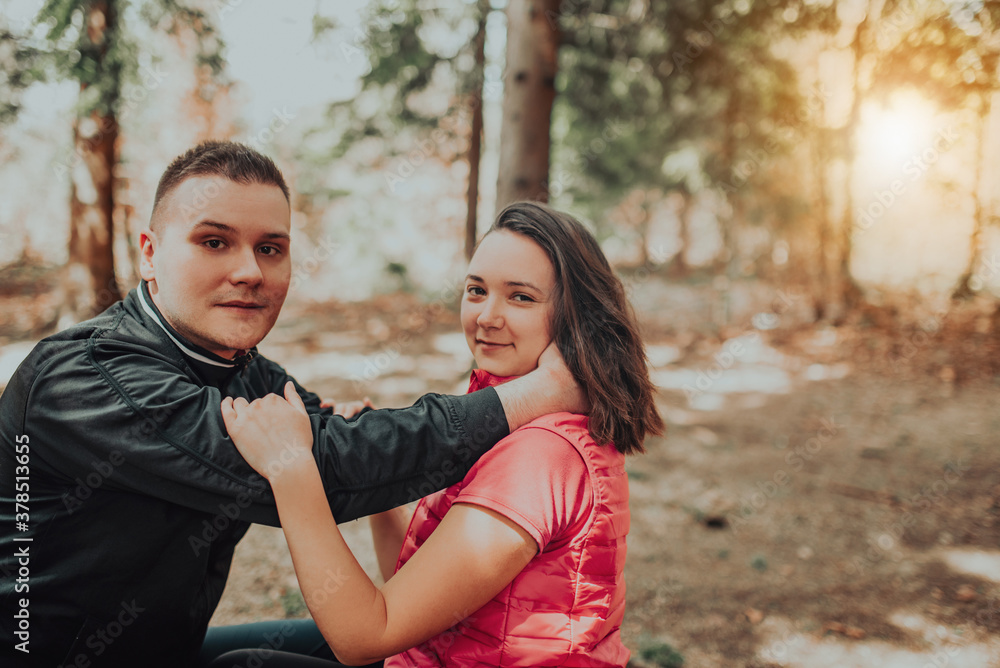 Young couple kissing in forest Young couple kissing in forest