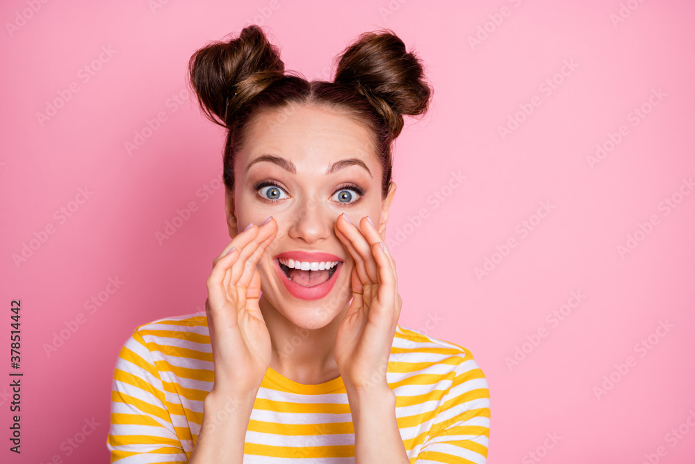 Closeup photo of attractive funny expression lady two buns yelling novelty information arms near mouth crowd people wear casual white yellow striped shirt isolated pink color background Closeup photo of attractive funny expression lady two buns yelling novelty information arms near mouth crowd people wear casual white yellow striped shirt isolated pink color background