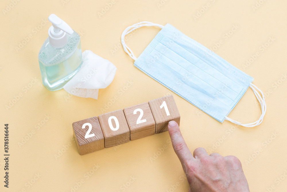 New year 2021 in healthcare concept, hand change wooden cubes. New year 2021 in healthcare concept, hand change wooden cubes.