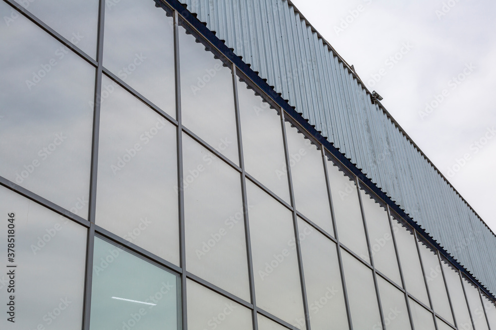 Panel building for industrial or warehouse use against the backdrop of a gray sky Panel building for industrial or warehouse use against the backdrop of a gray sky