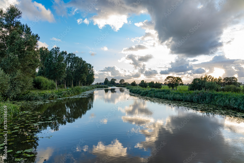Dark clouds during sunset over the canal of the Geerpolder near Zoetermeer