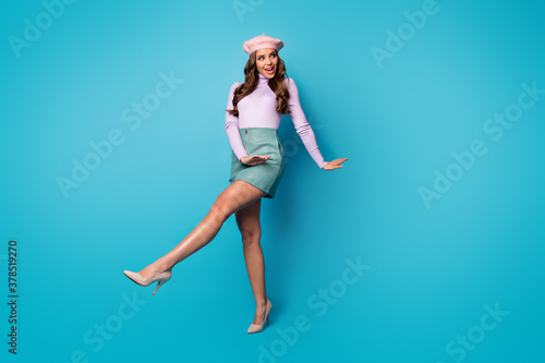 Fototapeta Naklejka Na Ścianę i Meble -  Full length body size view of her she nice attractive lovely pretty gorgeous slim fit thin cheerful wavy-haired girl walking having fun isolated on bright vivid shine vibrant blue color background