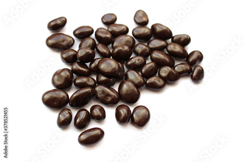 dark chocolate candies with nuts  white background