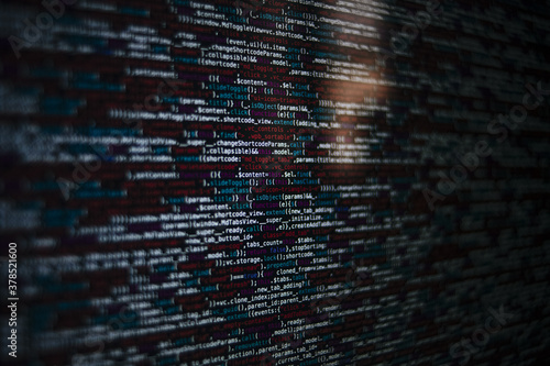 Closeup shot of a screen with HTML JavaScript source code for web page development data photo