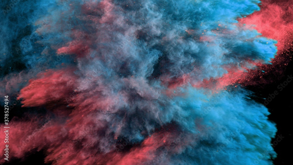 Explosion of colored powder on black background