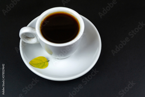 Cup of coffee  on a black background.