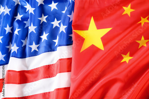 USA and China flags as background  top view. International relations