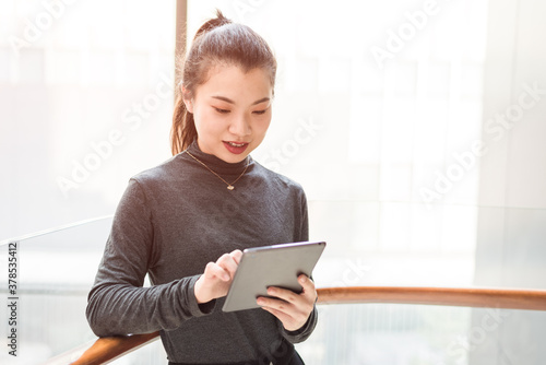 Young women are using tablets