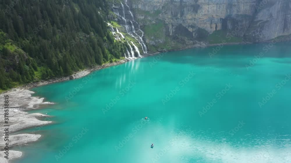 Mountain lake between the giant mountains on a cloudy and moody morning. It is captured in the Swiss Alps at Kandersteg with the DJI Mavic Pro 2. Mountain lake between the giant mountains on a cloudy and moody morning. It is captured in the Swiss Alps at Kandersteg with the DJI Mavic Pro 2.