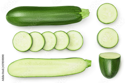 Fresh whole and sliced zucchini isolated on white background with clipping path and full depth of field. Top view. Flat lay