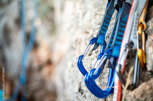 A few carabiners for climbers on a rock photo