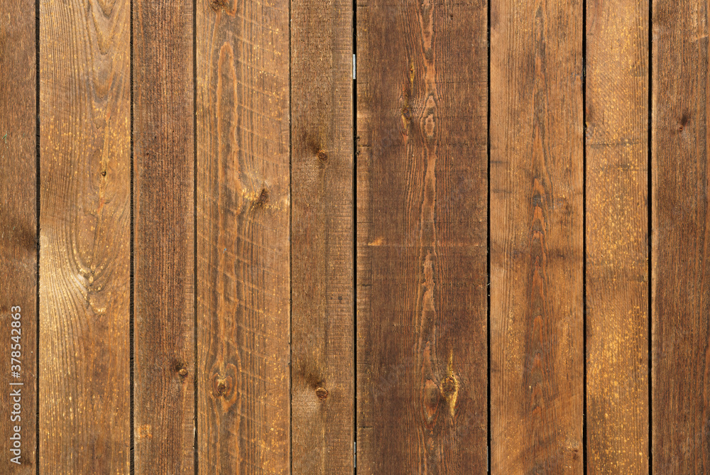 Detail of old unpainted wooden door with horizontal slats. Detail of old unpainted wooden door with horizontal slats.