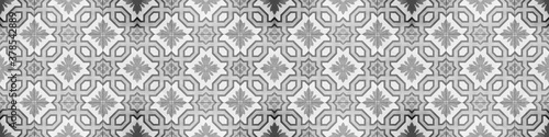 Seamless gray grey white vintage retro grunge cement stone concrete tile wallpaper texture background wide panorama banner, with geometric square rhombus diamond flower pattern print mosaic